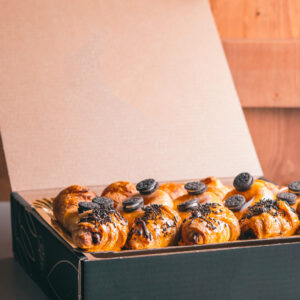 Croissants and chocolate donuts food delivery sweet snacks in a box